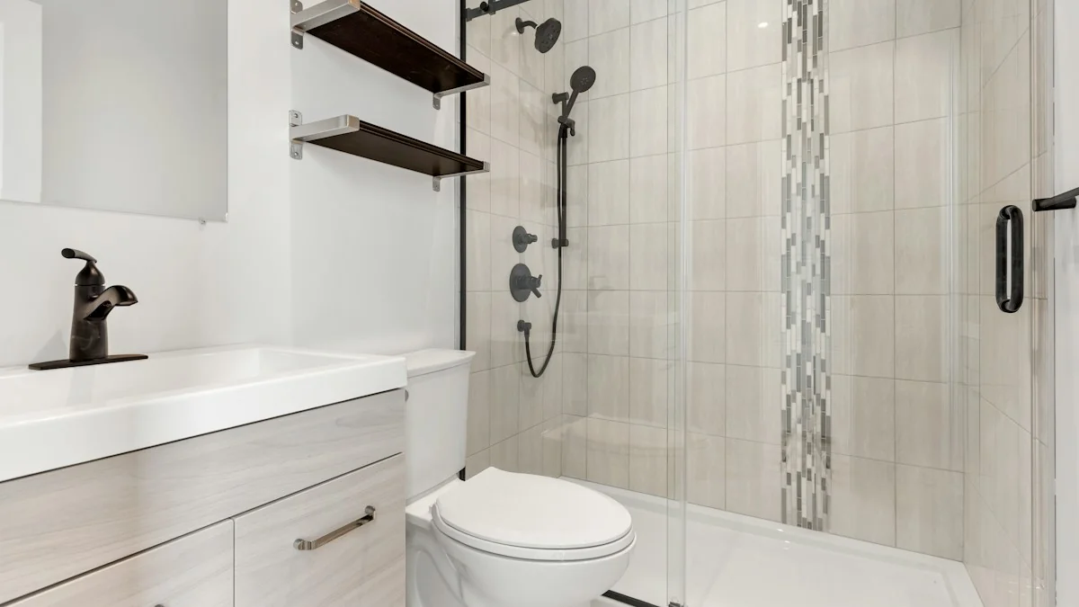A narrow bathroom with a wall-hung toilet beside a tiled walk-in shower fitted with a handheld sprayer on a flexible hose