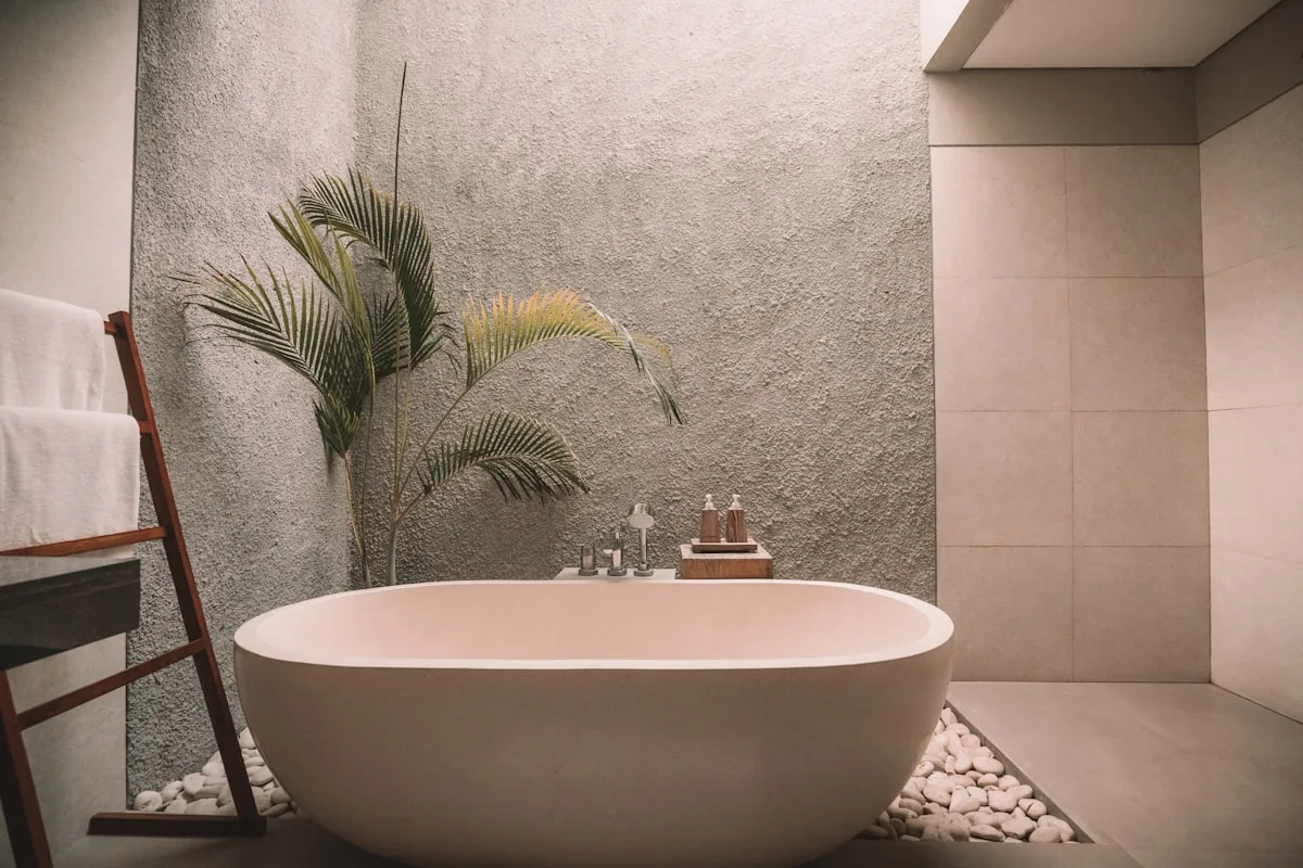 A modern white bathroom with warm lighting and a premium toilet setup